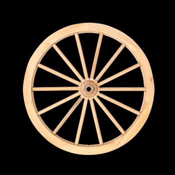 Clean wooden wheel from a cart used for decoration purposes isolated on a black background.