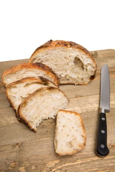 Freshly cut slices of white artisan sourdough bread on isolated a white background.