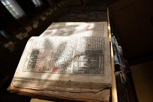 Old Christian manuscript written in Cyrillic on church pulpit.