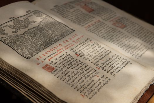 Close up of old Christian manuscript written in Cyrillic on church pulpit.