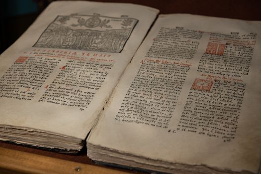 Close up of old Christian manuscript written in Cyrillic on church pulpit.