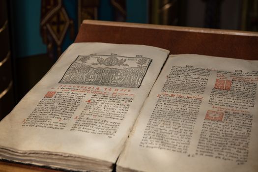 Close up of old Christian manuscript written in Cyrillic on church pulpit.