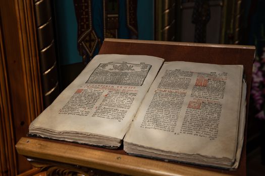 Old Christian manuscript written in Cyrillic on church pulpit.