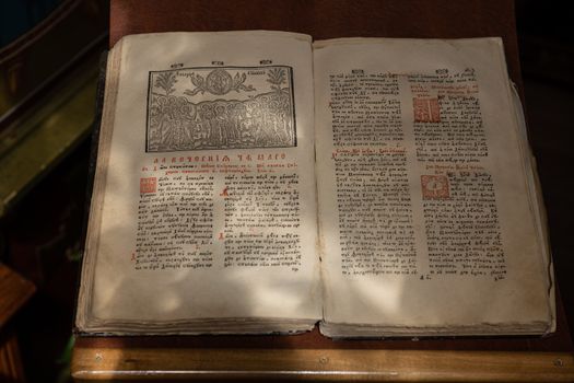 Old Christian manuscript written in Cyrillic on church pulpit.