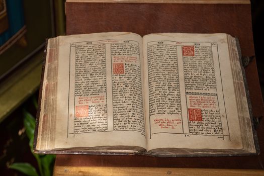 Old Christian manuscript written in Cyrillic on church pulpit.