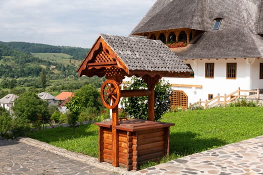Barsana Monastery Architectural Detail - Traditional Wooden Fountain (Maramures, Romania).