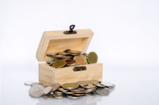 Inner lid with gold coin, white background Isolate The concept of treasure and value for money.