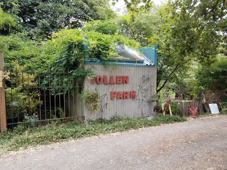 shed with Tollen Farm letters and rock or gravel driveway