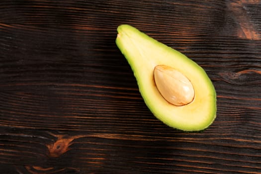 A sliced avocado on a cutting board