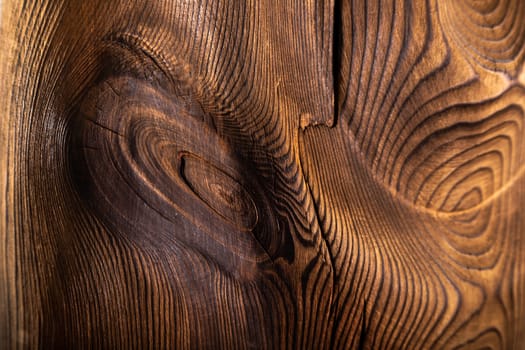 Brown wavy wooden surface. Art processing of a tree