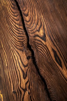 Brown wavy wooden surface. Art processing of a tree