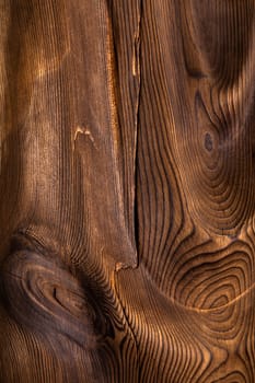 Brown wavy wooden surface. Art processing of a tree