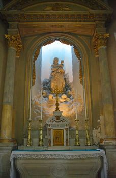 Altar with virgin Mary at Catholic cathedral in Avranches, France