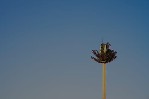 mobile telecommunications antenna camouflaged as a fake palm tree