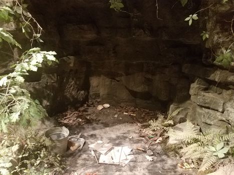 cave with turtle shells and archaeology tools and materials