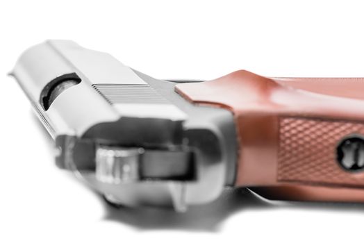 closeup of a gas pistol on a white background
