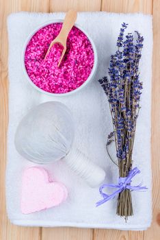 spa objects soothing lavender for bath, spa and massage objects close-up view from above on a terry towel