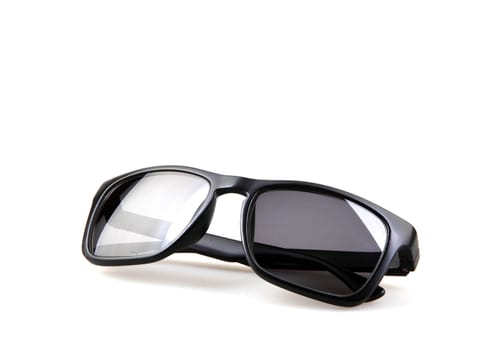 Close-Up Of Black Sunglasses Against White Background