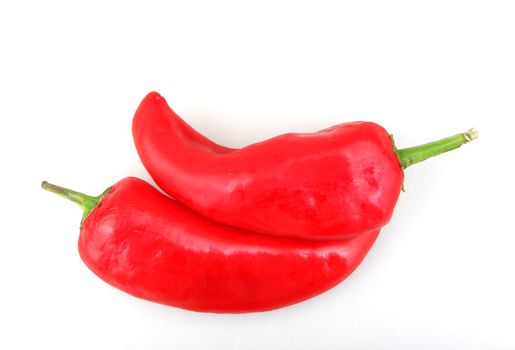 Close-Up Of Red Chili Pepper Against White Background