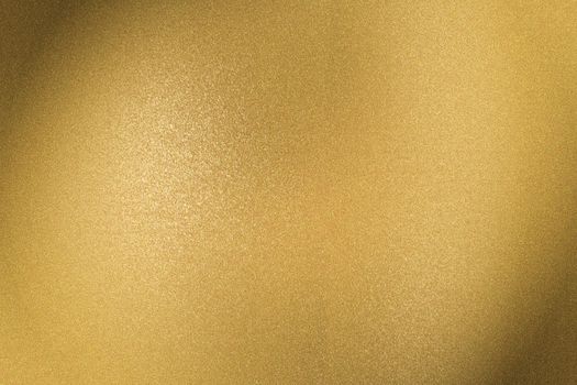 Brushed golden metal sheet surface, abstract texture background