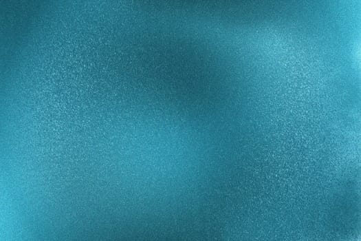 Glowing brushed blue metallic wall surface, abstract texture background