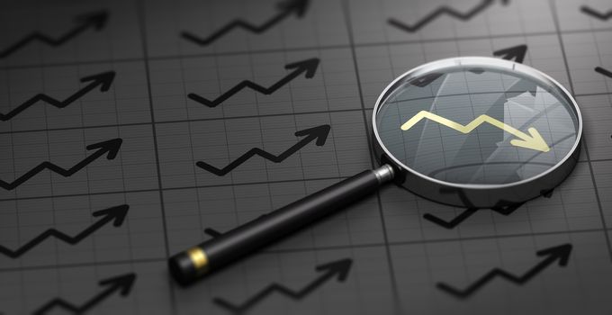 3D illustration of a magnifying glass over black background and golden decreasing chart symbol. Concept of brokerage.