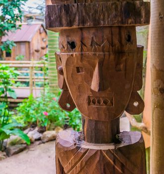 carved wooden statue of a native person, african garden decorations