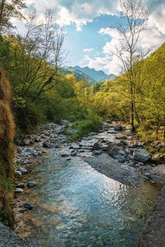 Wonderful view of the Vertova torrent at sunset, in the middle of the Orobiche mountains with its beautiful tiny waterfalls.