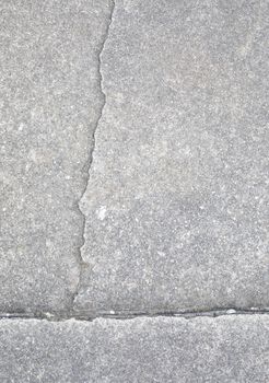 Light gray aggregate material with crack. Background material;