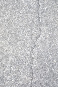 Light gray aggregate material with crack. Background material;
