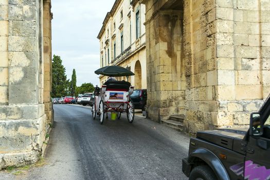 Corfu, Greece - August 26, 2018: decorated horse carriage that offer a unique tour around Corfu town.