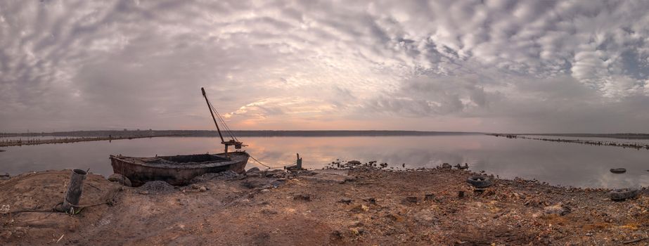 Old boat of the mud getters on the salt lake Kuyalnik in Odessa, Ukraine