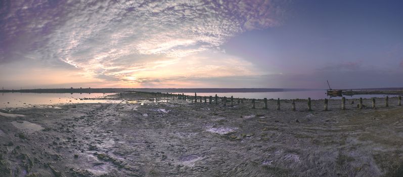 Sunset clouds over a drying salt lake