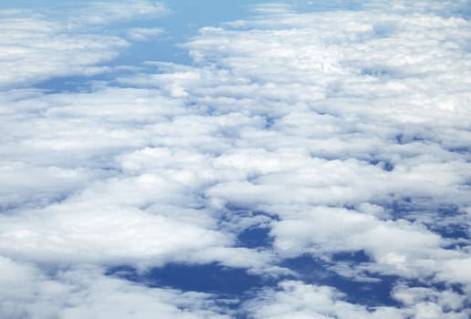 Wing of an airplane and the land below