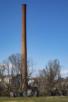 Tall brick smokestack marks the location of an old tannery.