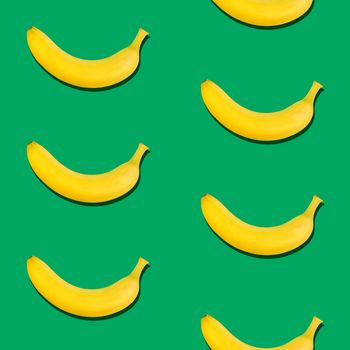 Seamless pattern of fresh ripe yellow bananas on green background