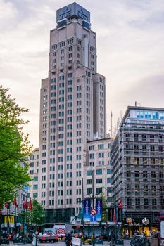 Antwerpen, Belgium, April 23, 2019, The KBC bank building in antwerp city with street view, large sky scraper in a popular belgian city