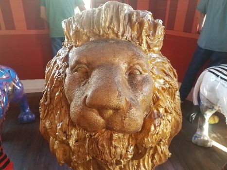 gold painted lion face statue up close in Ponce, Puerto Rico