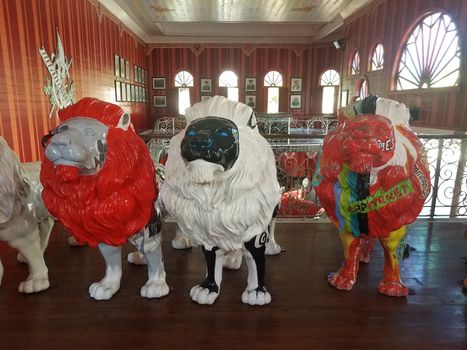 brightly colored or painted lion statues in Ponce, Puerto Rico