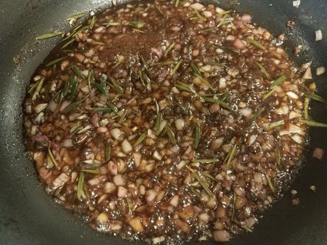 sweet brown fig and rosemary sauce cooking in frying pan or skillet