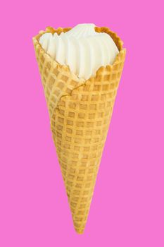 Vanilla ice cream in waffle cone isolated on bright pink and Lee crimson background, vertical close-up frame.