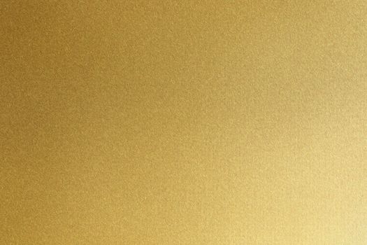 Brushed golden metallic sheet surface, abstract texture background