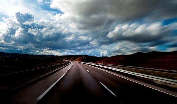 Road scenery. Travel concept.Cloudy sky and high road.