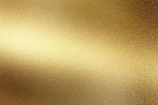 Glowing polished golden metal wall surface, abstract texture background