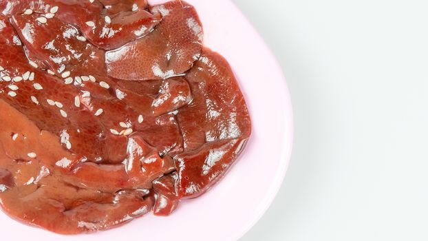 top view raw pork liver on plate  isolated on white background