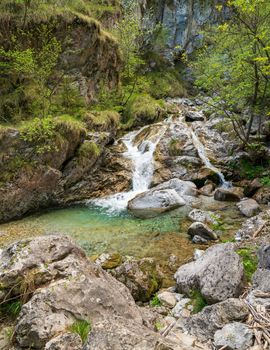 Wonderful view of the Vertova torrent at sunset, in the middle of the Orobiche mountains with its beautiful tiny waterfalls.