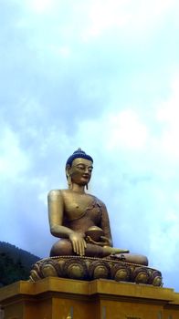 The Buddha Dordenma with the tallest statue of Buddha towering over a beautiful value in Thimpu, Bhutan.