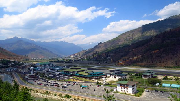 A beautiful view of the Paro International Airport in Bhutan on the backdrop of Himalayan moutains.