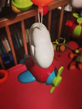 toy airplane in a baby bed close up photo