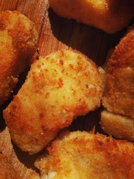 pieces of fried breaded chicken or fish close up